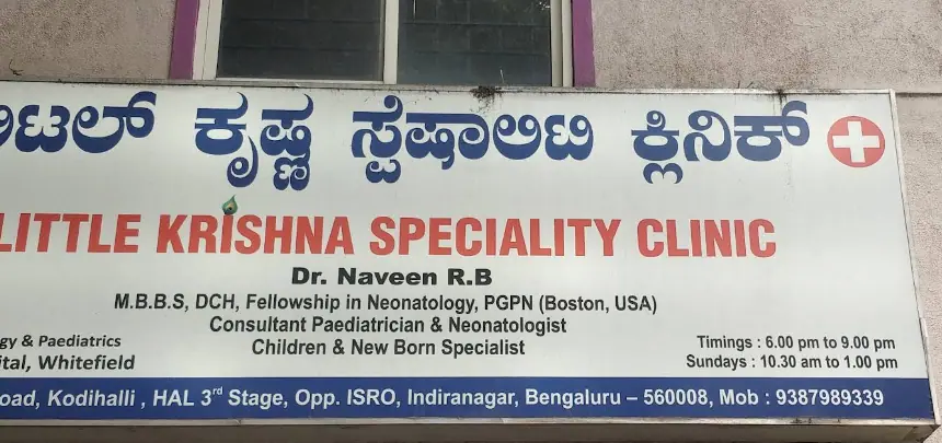 Clinic signboard with Dr. Naveen R.B’s name and timings